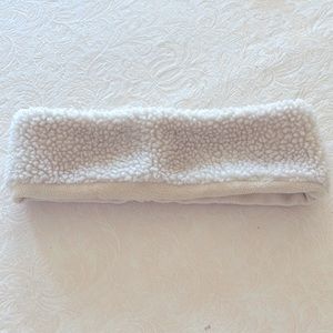 Woman’s cream headband warmer accessory